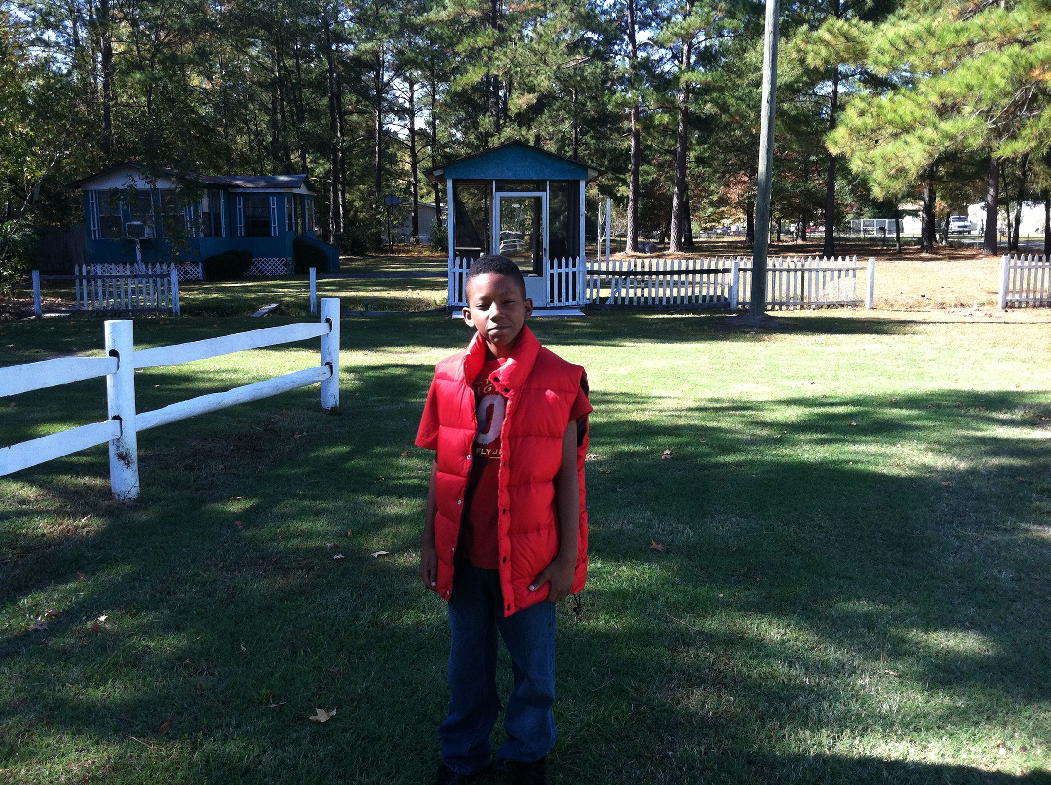 Ky'Ree wearing daddy's vest at grandma's house